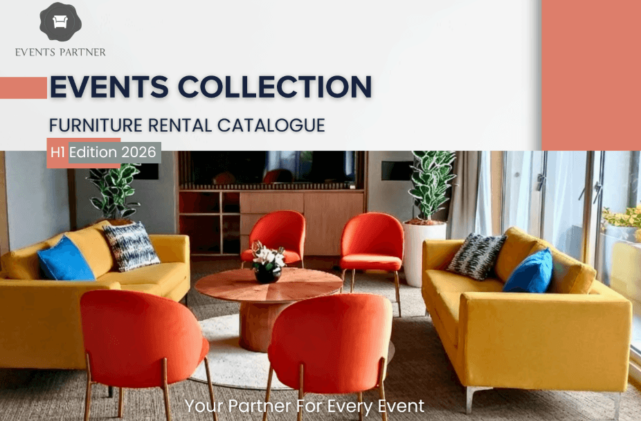 A modern lounge setup with yellow sofas, orange and red chairs around a round wooden table, featured on a furniture rental catalogue cover.